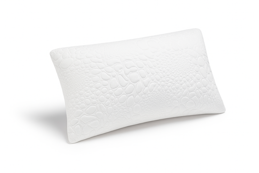 Close-up view of Pebble Essential pillow showing luxurious fabric texture and supportive memory foam design