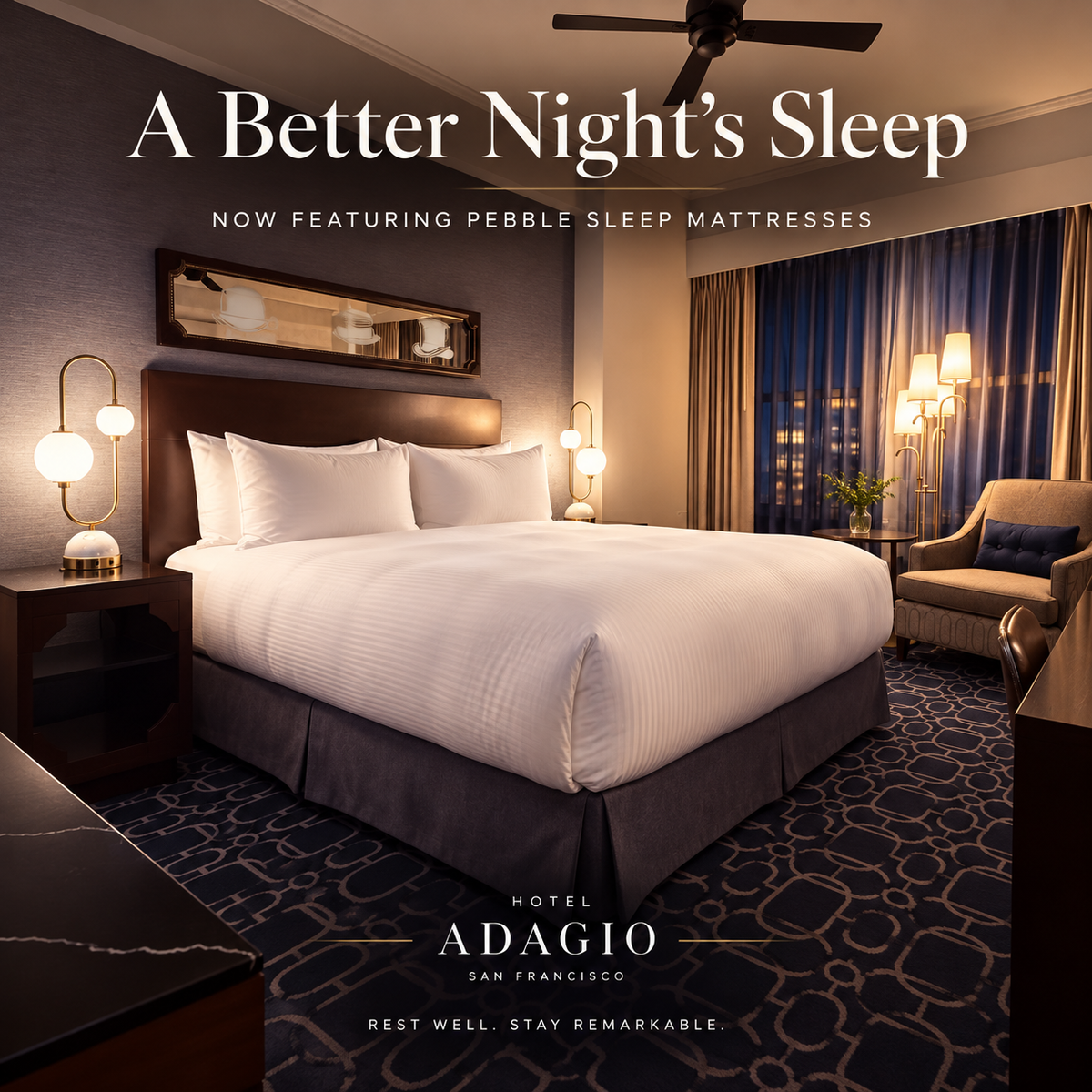 Finished Hotel Adagio guestroom with a made bed.